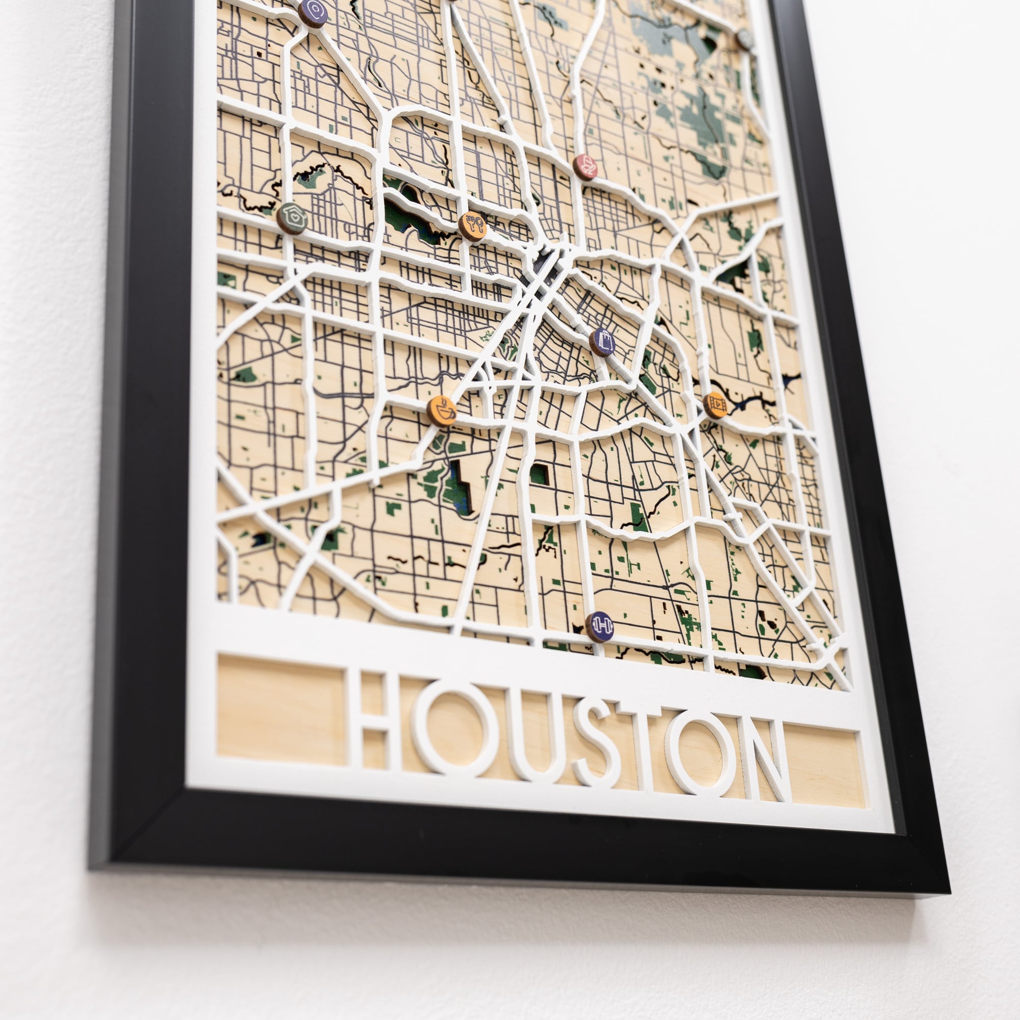Framed map of Houston with decorative elements on a white background