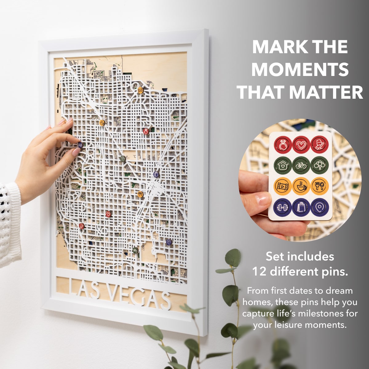Framed Las Vegas map with decorative pins on a white wall.