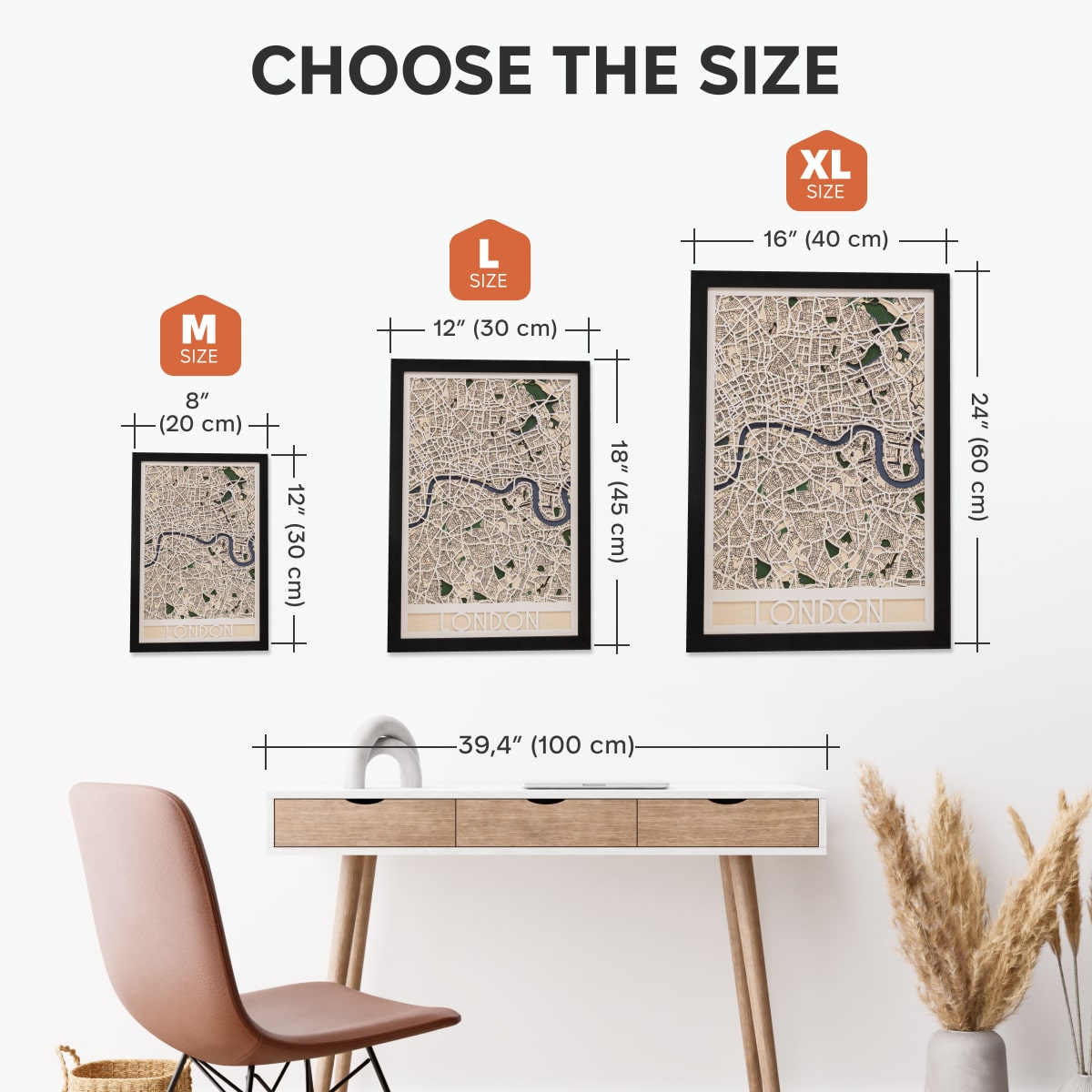 Size chart for framed maps with dimensions and a desk and chair in the background.