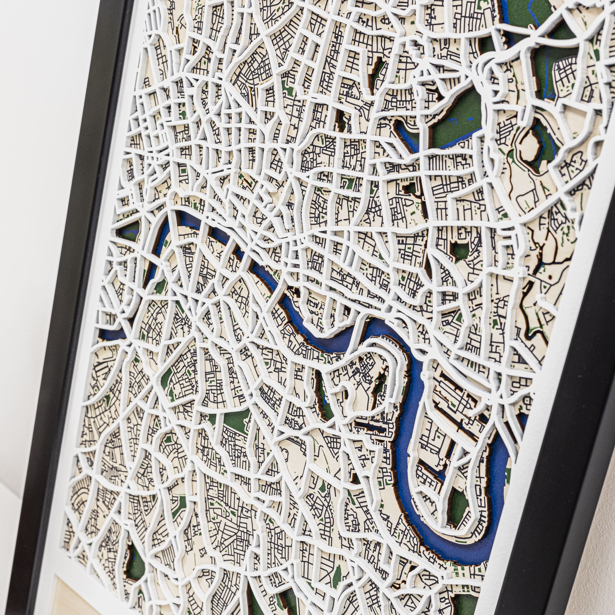 Wooden cutout map with a black frame