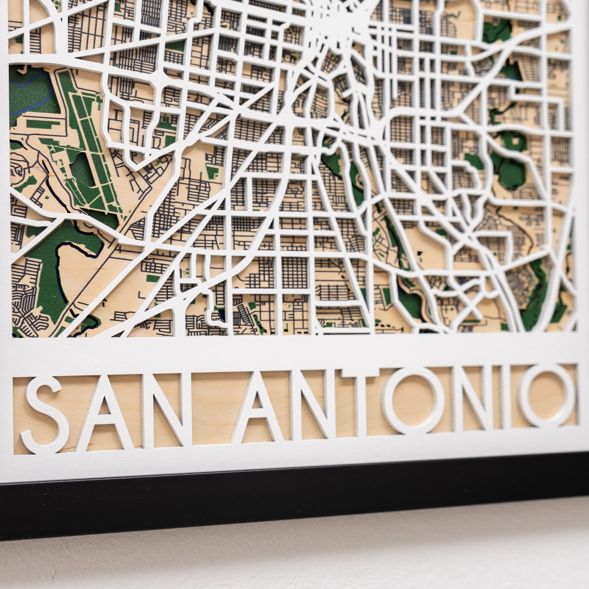 Wooden model of San Antonio's street layout with 'San Antonio' text below