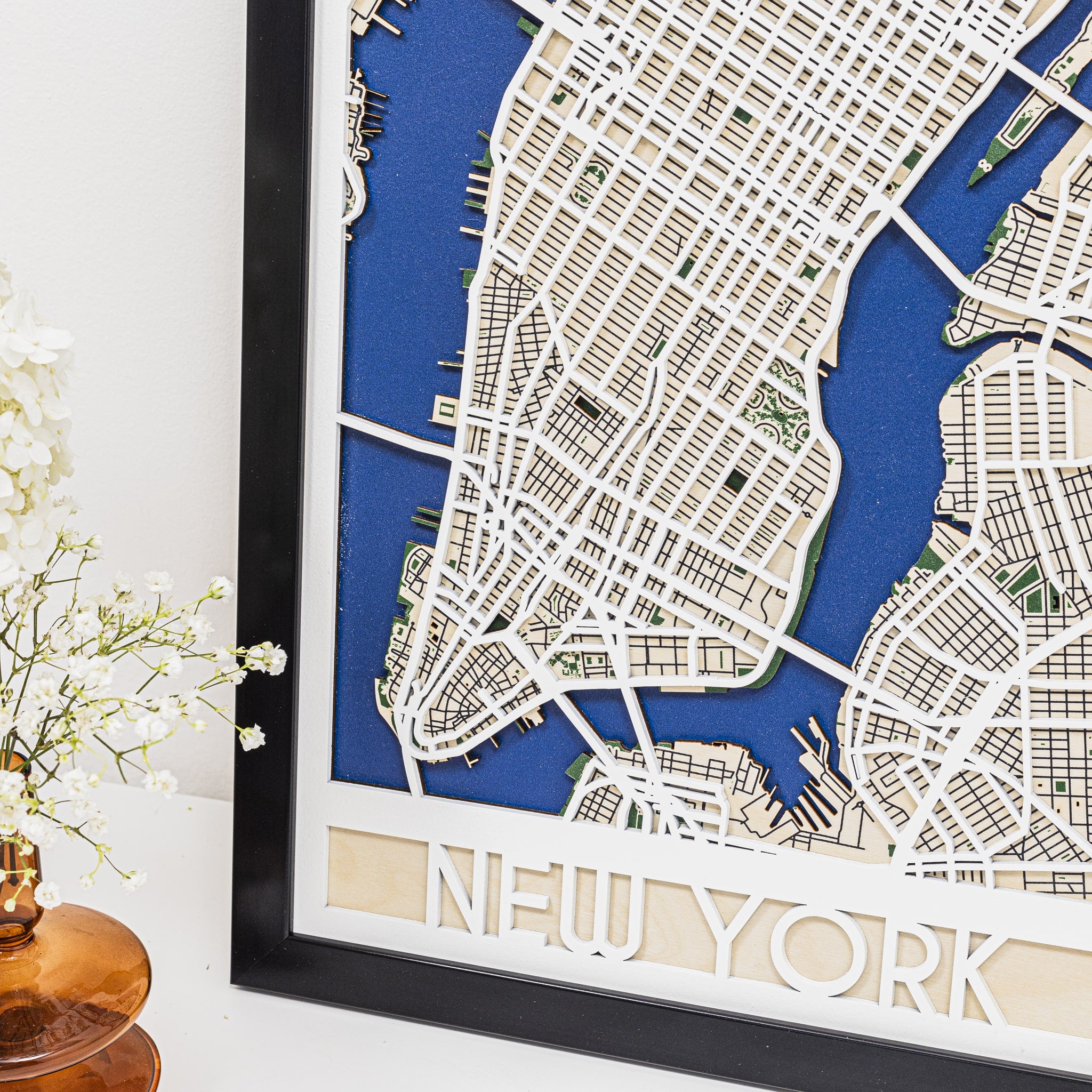 Framed map of New York with a blue background
