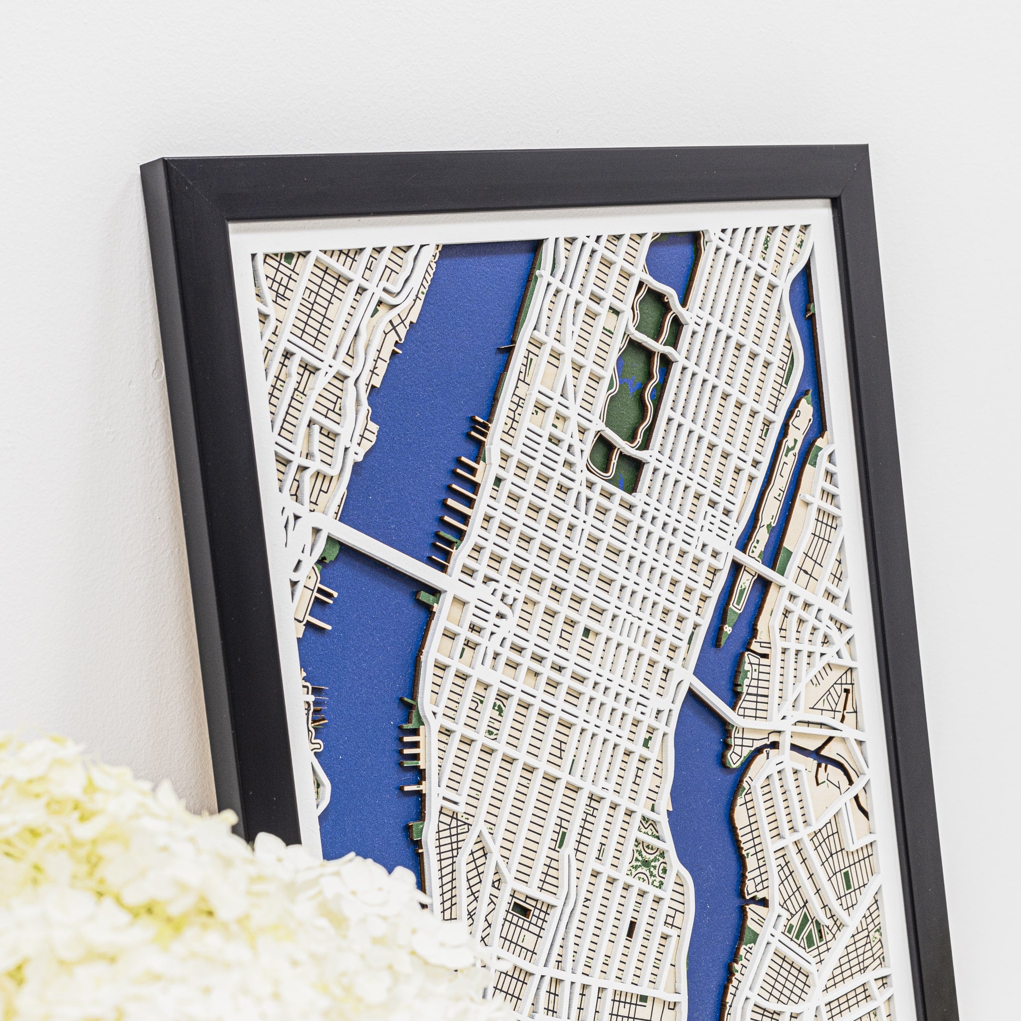 Framed city map with a blue background and white text