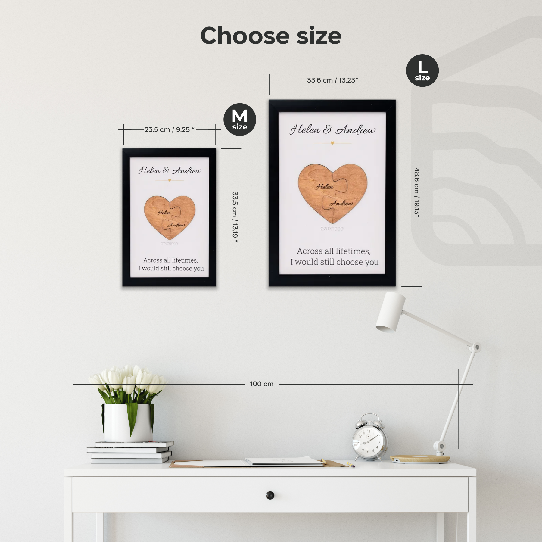 Two framed heart-shaped prints with personalized text on a wall above a desk.