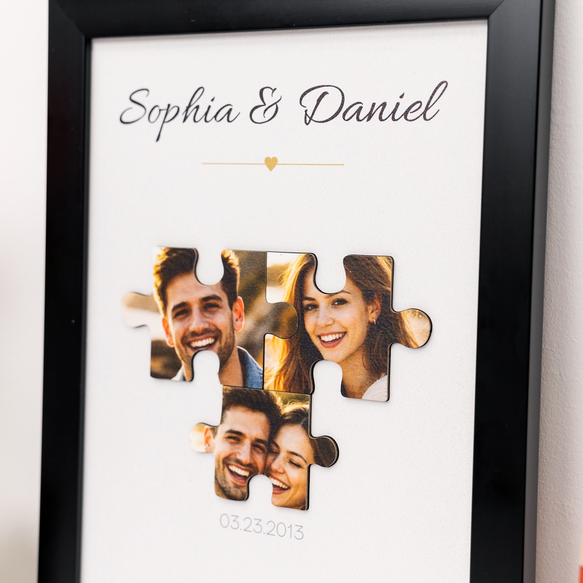 Framed puzzle photo display with 'Sophia & Daniel' and a heart symbol.