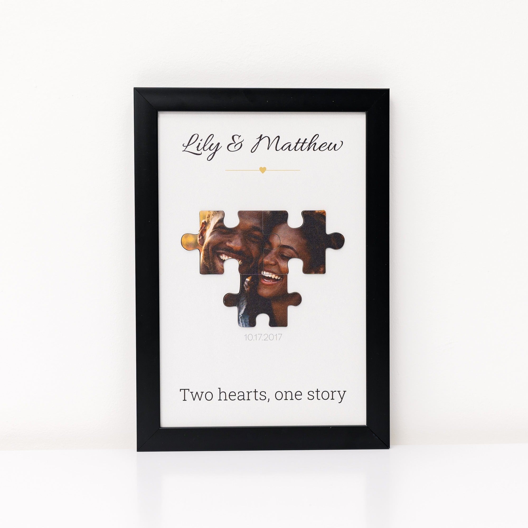 Framed artwork with a couple's photo and text 'Two hearts, one story' on a white background