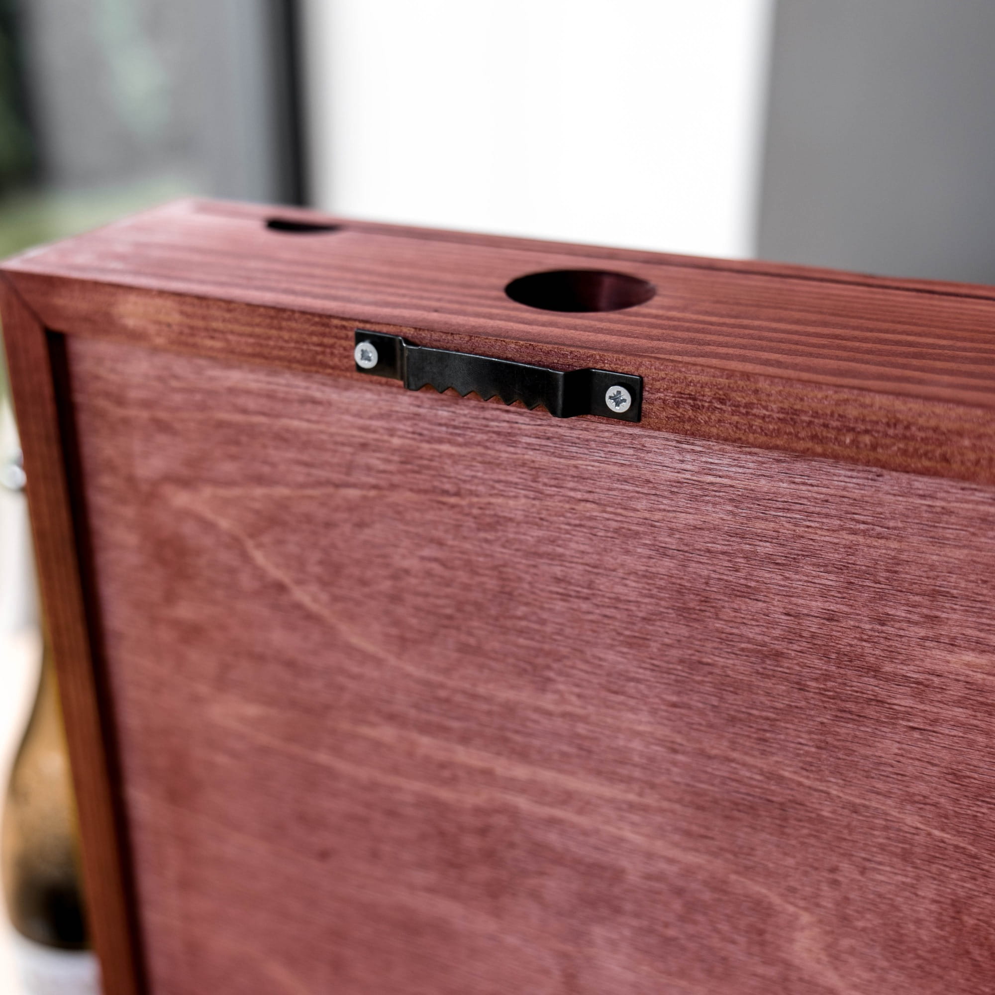 wooden box with a black metal latch