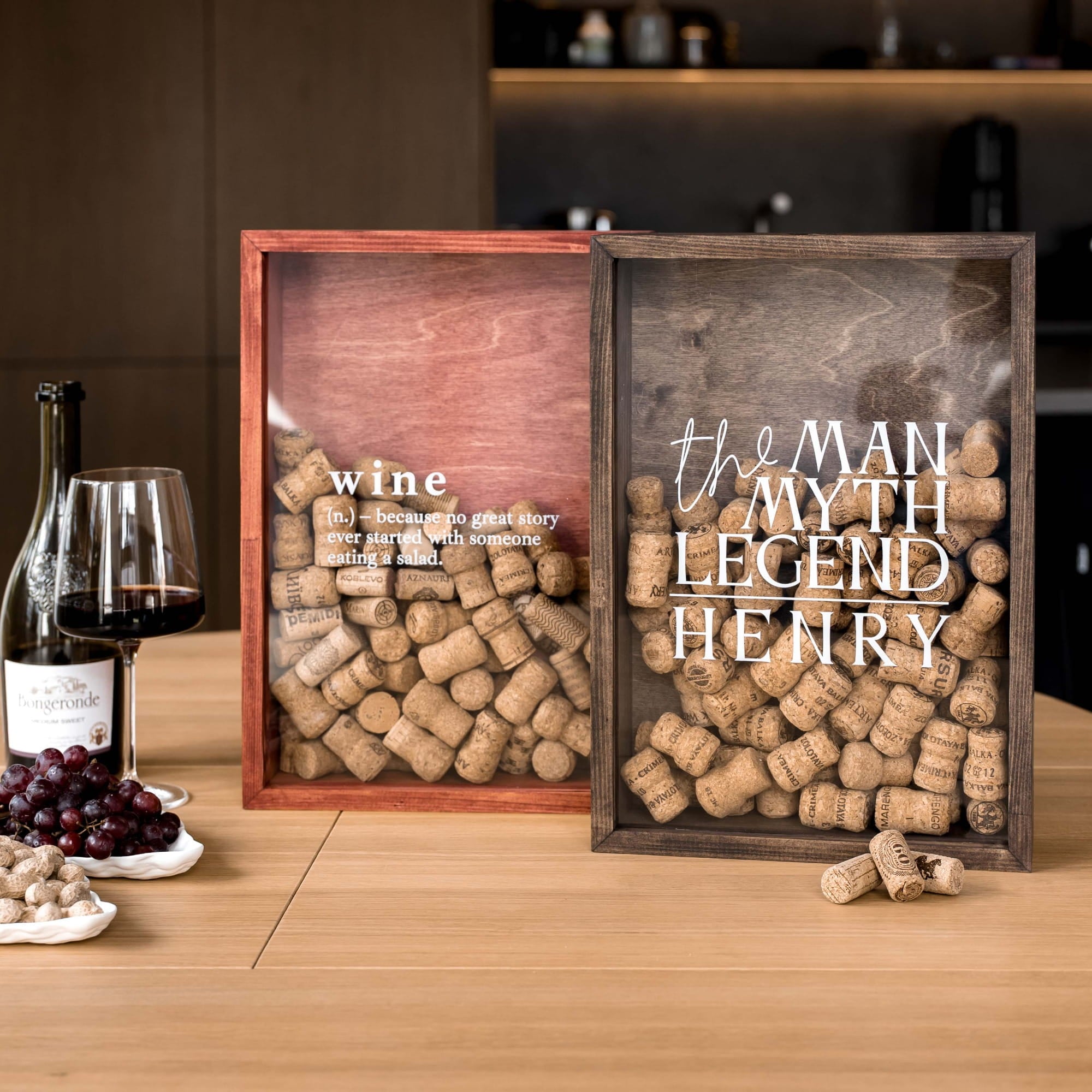 Two decorative wooden wine cork boxes on a wooden table