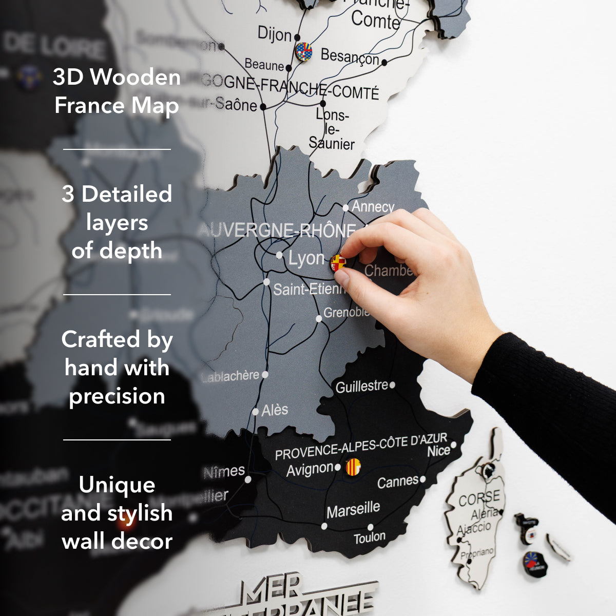 Woman interacting with a wall-mounted map of France