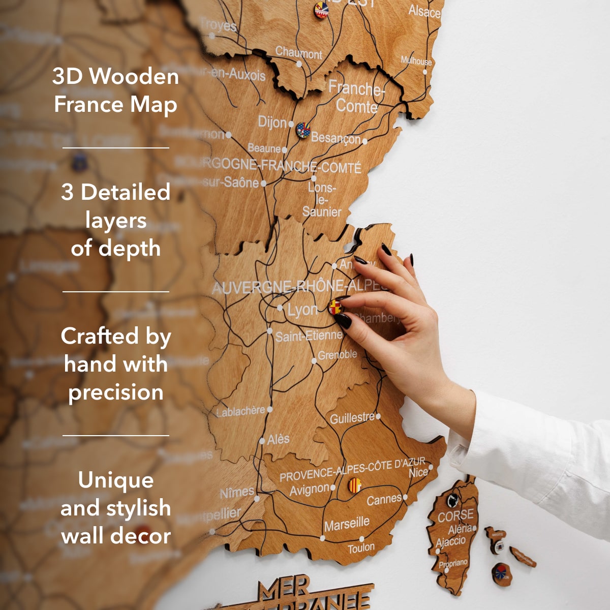 3D wooden map of France with hand interacting with it, text highlighting features.
