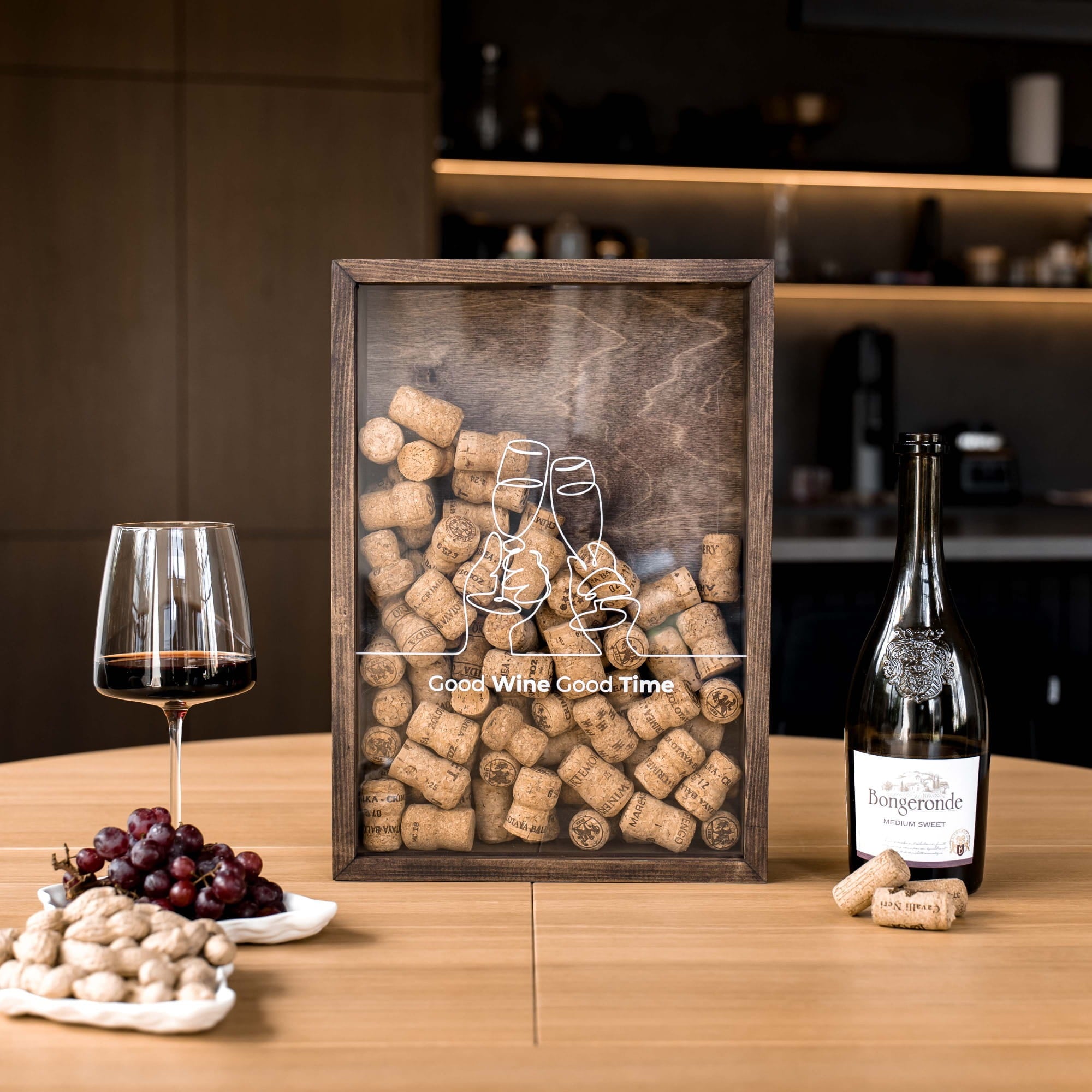 A square wooden framed art piece filled with wine corks