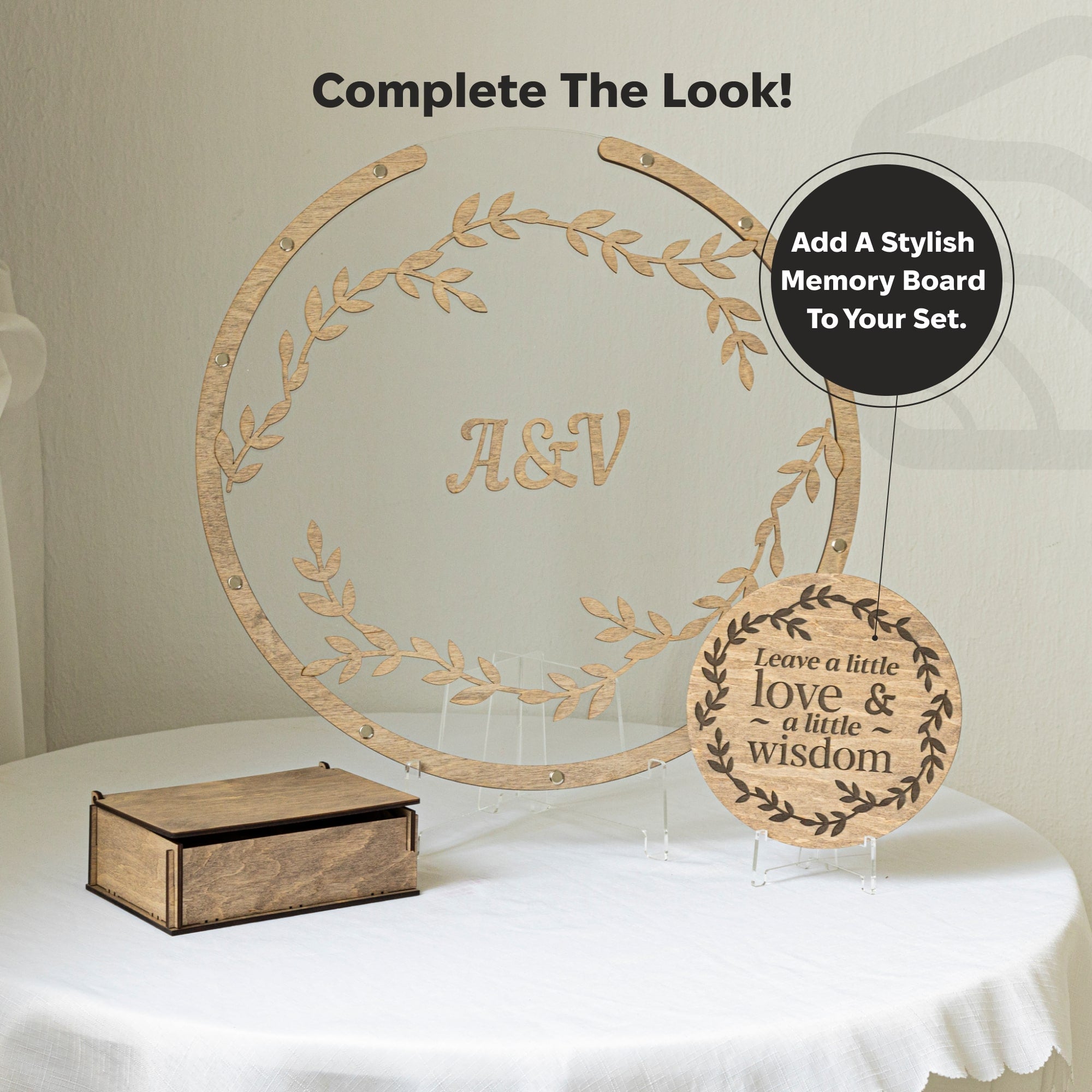 Wooden decorative items with 'A&V' and 'love & wisdom' text on a white surface.