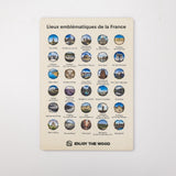 Poster with emblematic locations of France and 'Enjoy the Wood' branding on a light gray background