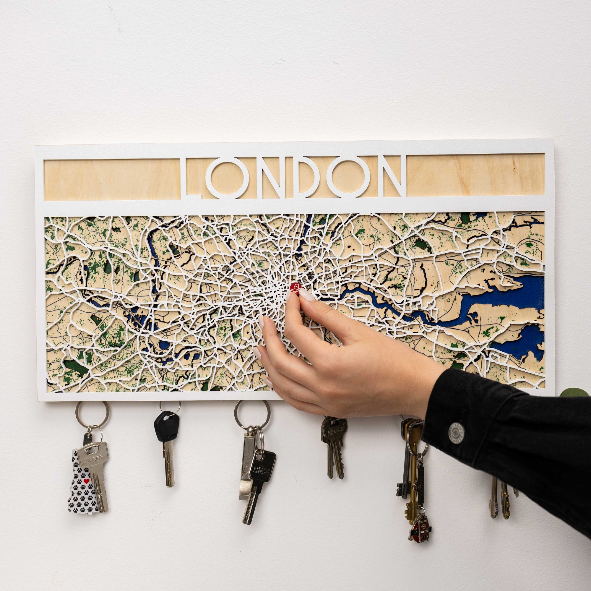 Key holder with London map design on a white wall