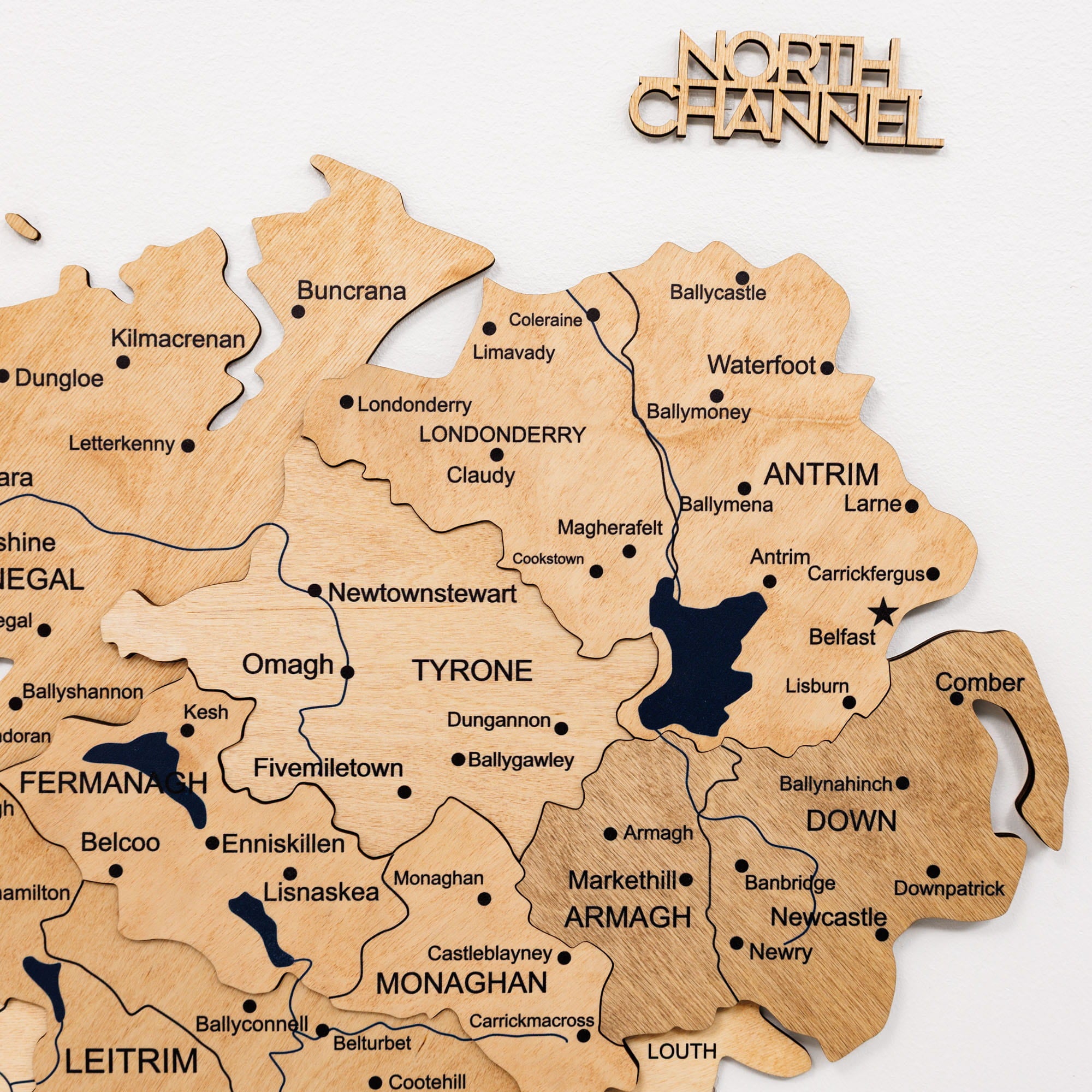 Wooden map of Northern Ireland with 'North Channel' branding.