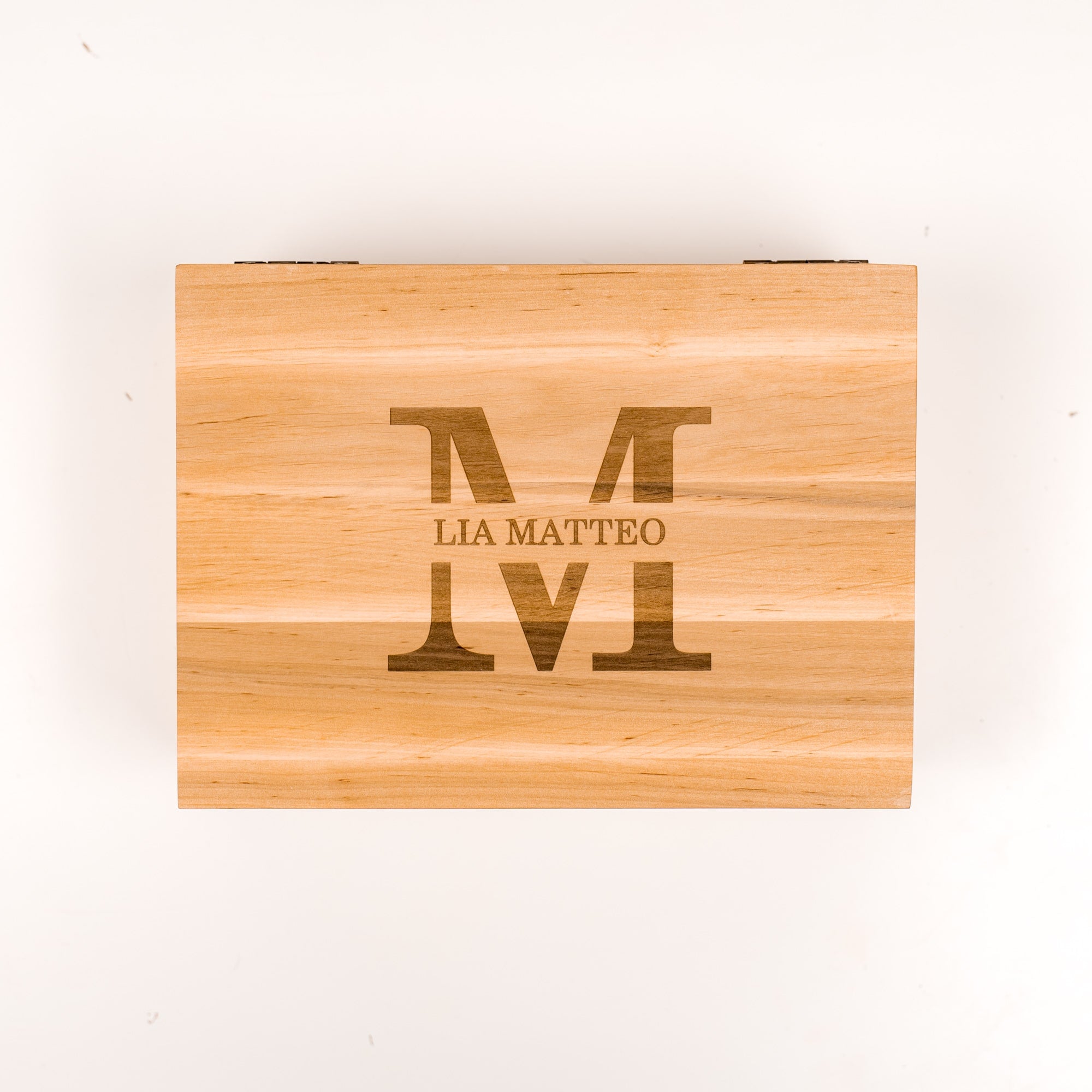 Wooden cutting board with engraved text on a white background