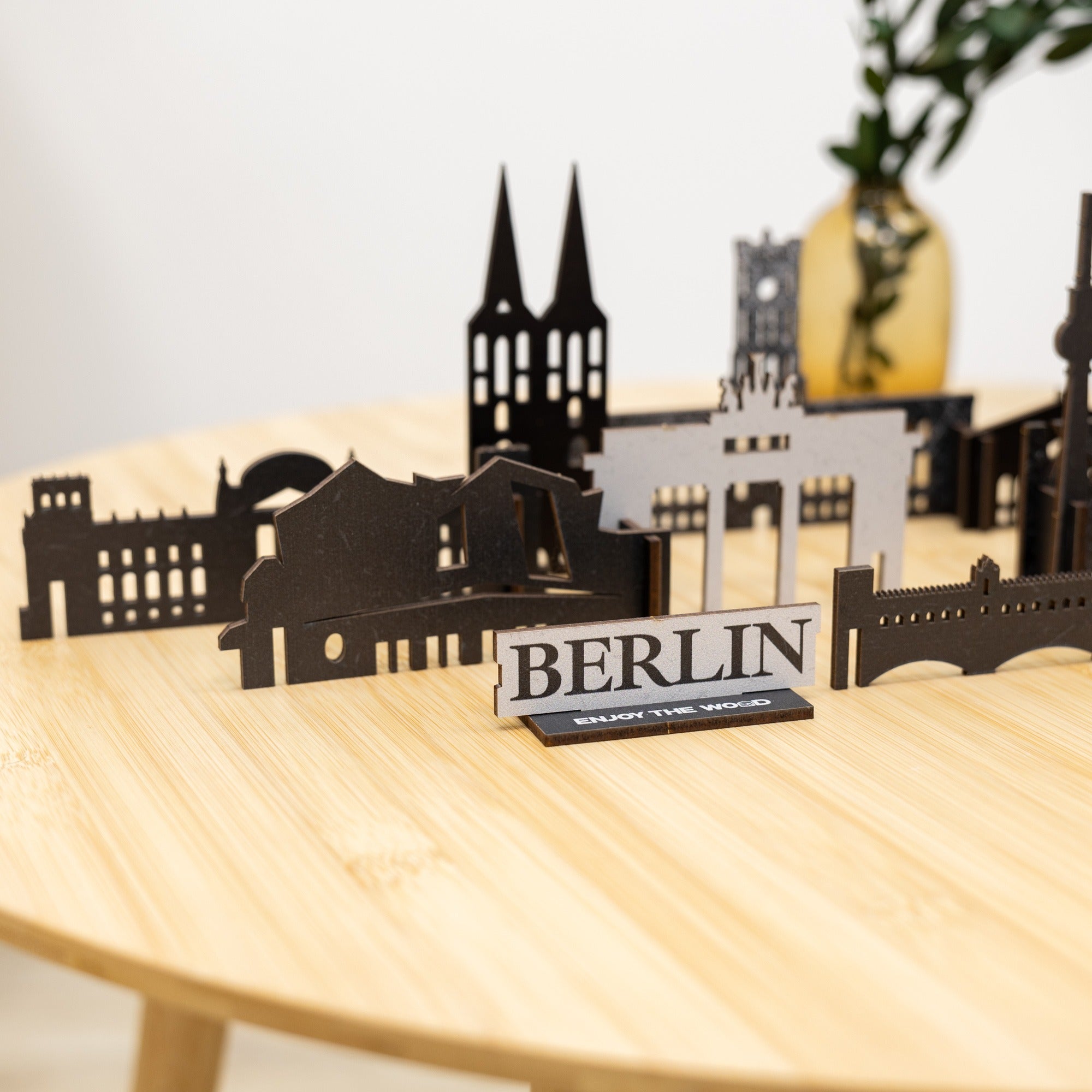 Model of Berlin skyline on a wooden table with a blurred background