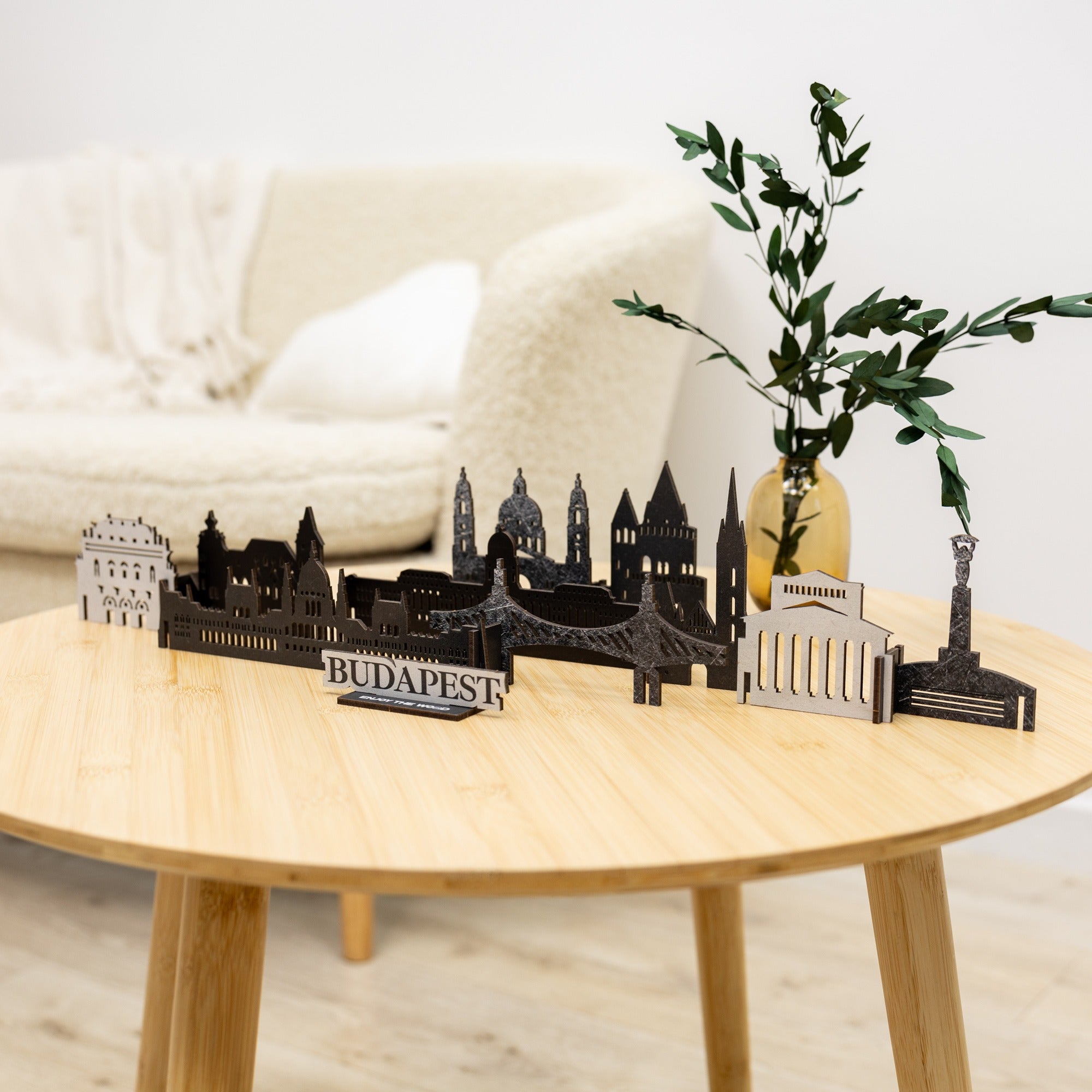 Model of Budapest skyline on a wooden table with a plant in the background