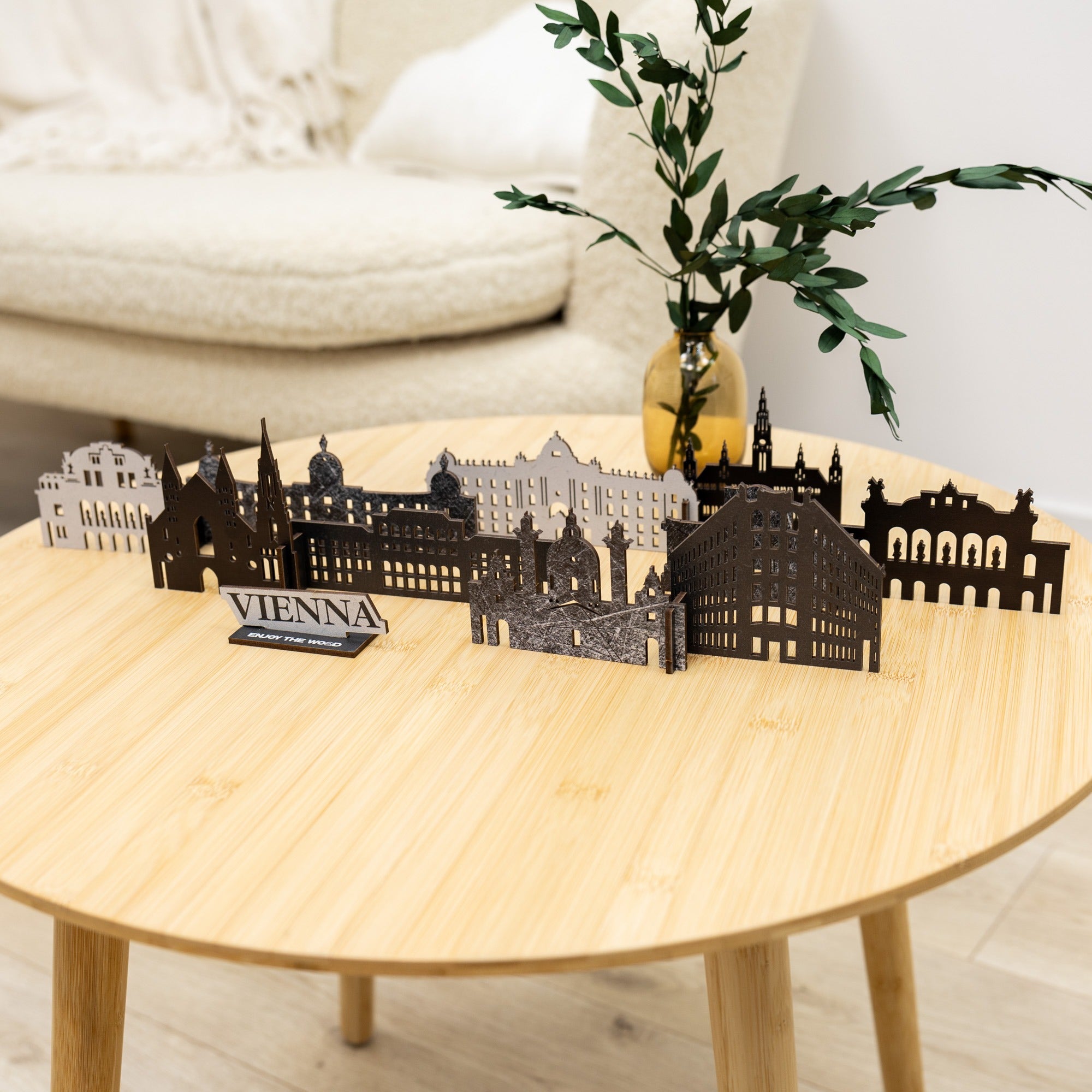Model of Vienna skyline on a wooden table with a plant in the background