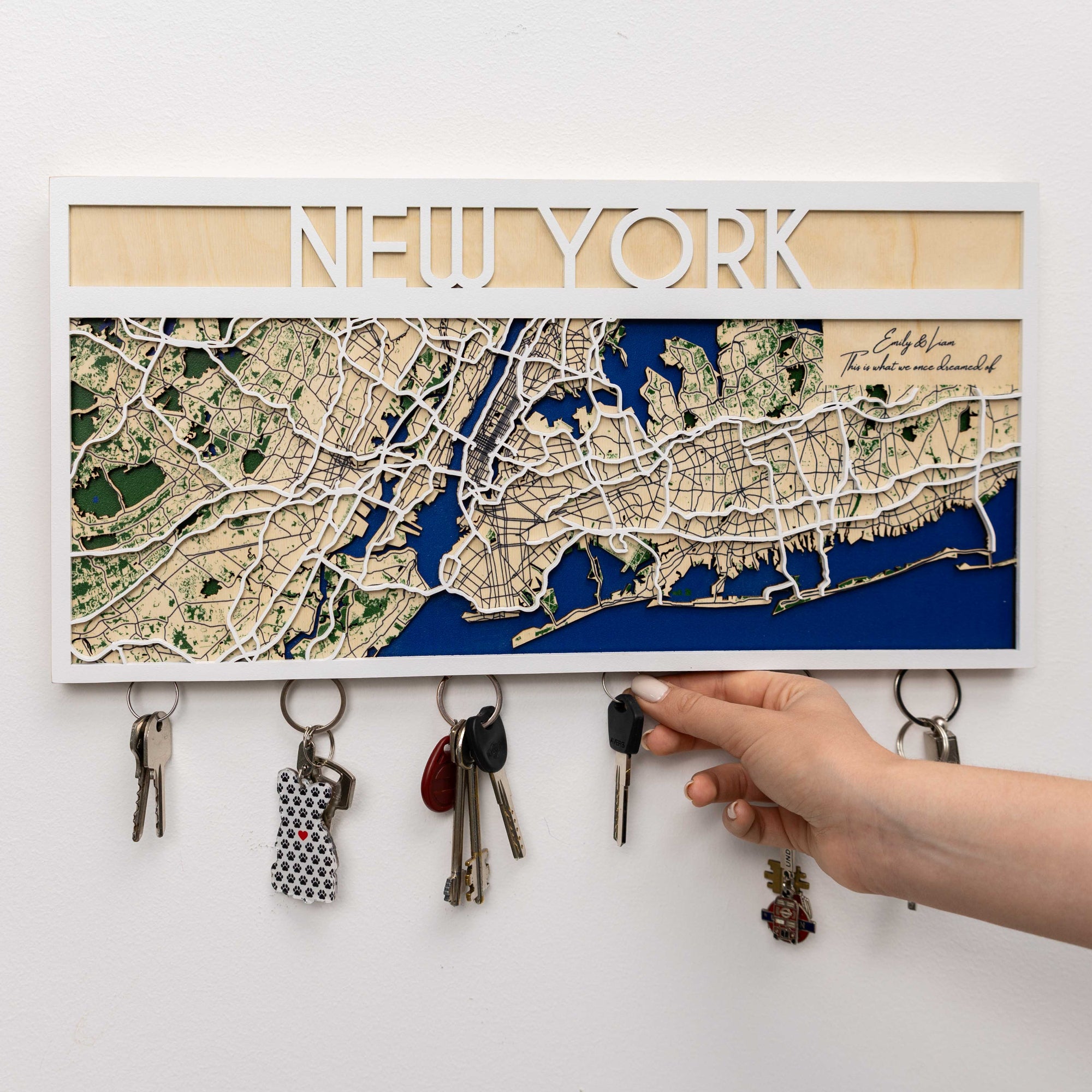 Key holder with New York map design on a white wall
