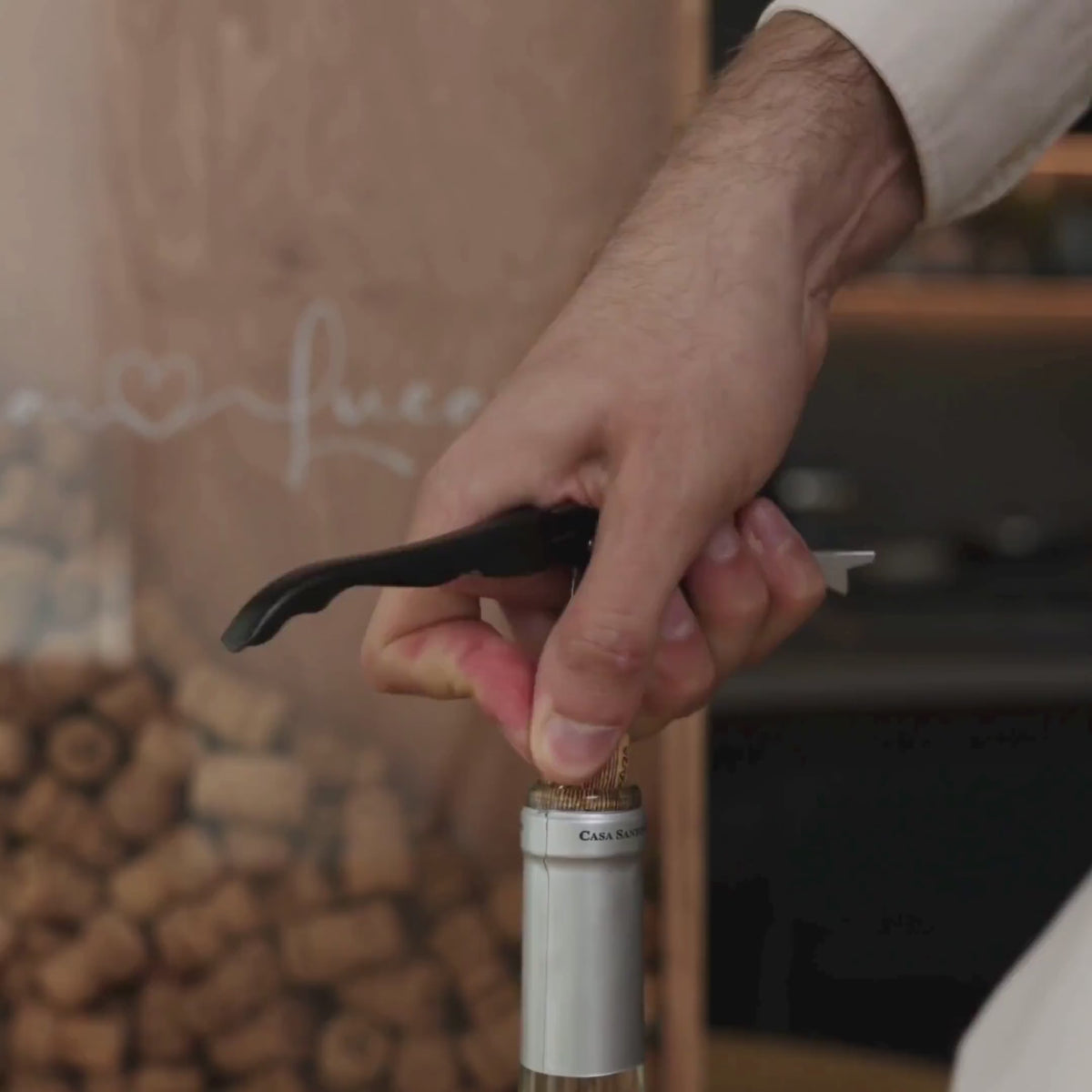 The box contains many wine corks under a clear glass front