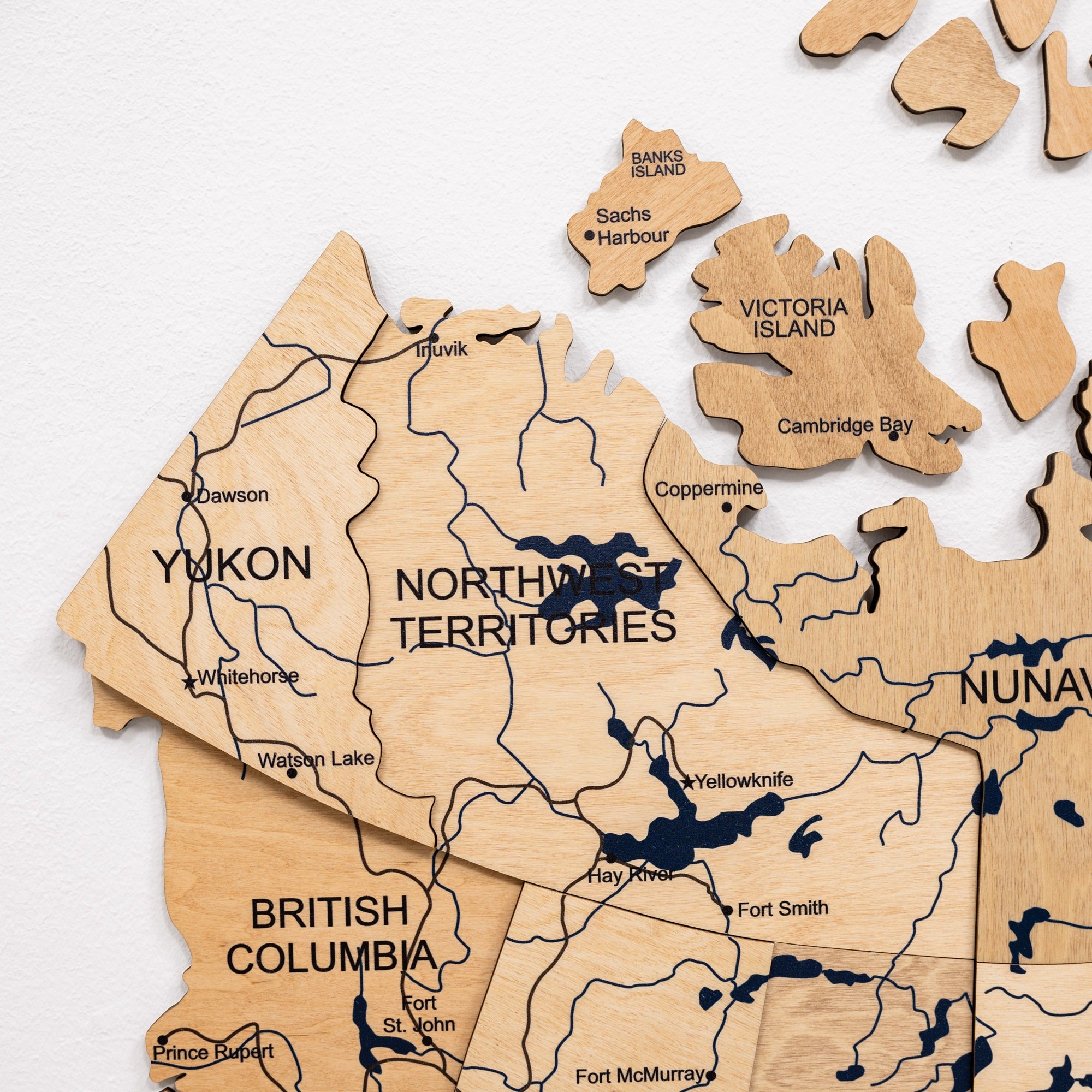 Wooden puzzle map of Canada with regions labeled