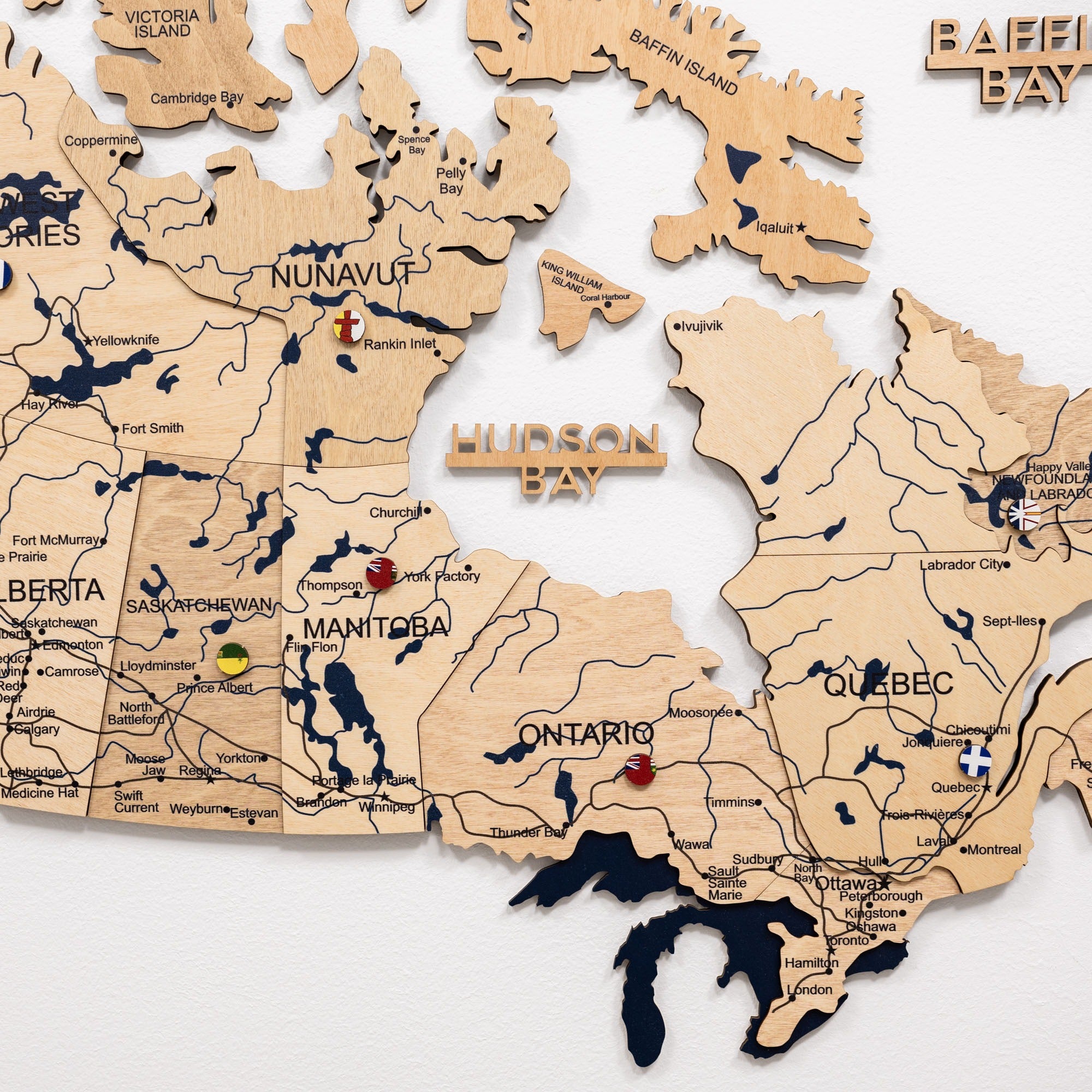 Wooden puzzle map of Canada on a white background