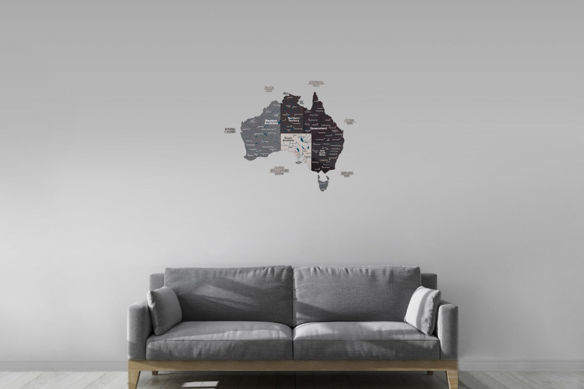 Gray sofa in a room with a world map wall decal