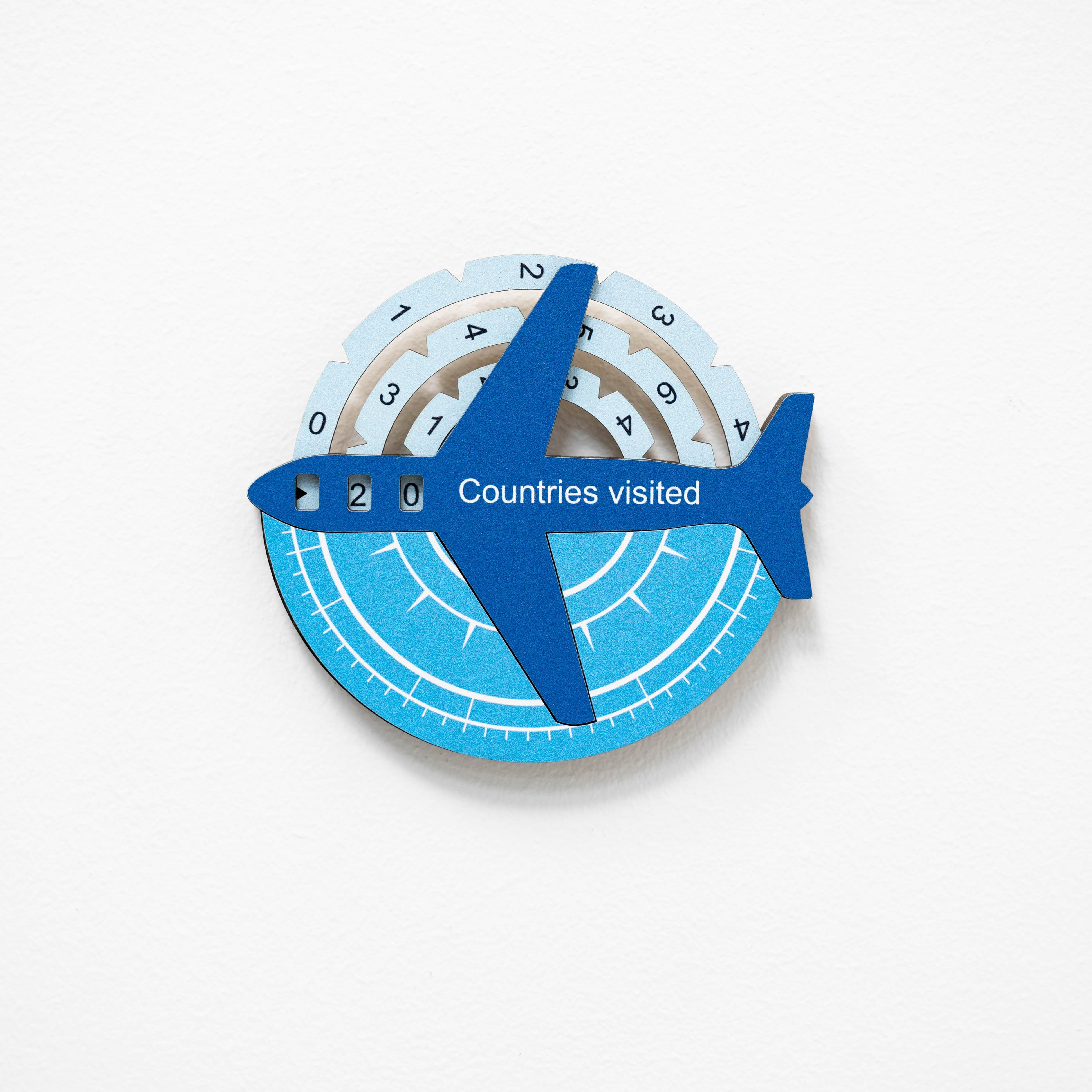 Circular device with airplane icon and 'Countries visited' text on a white background