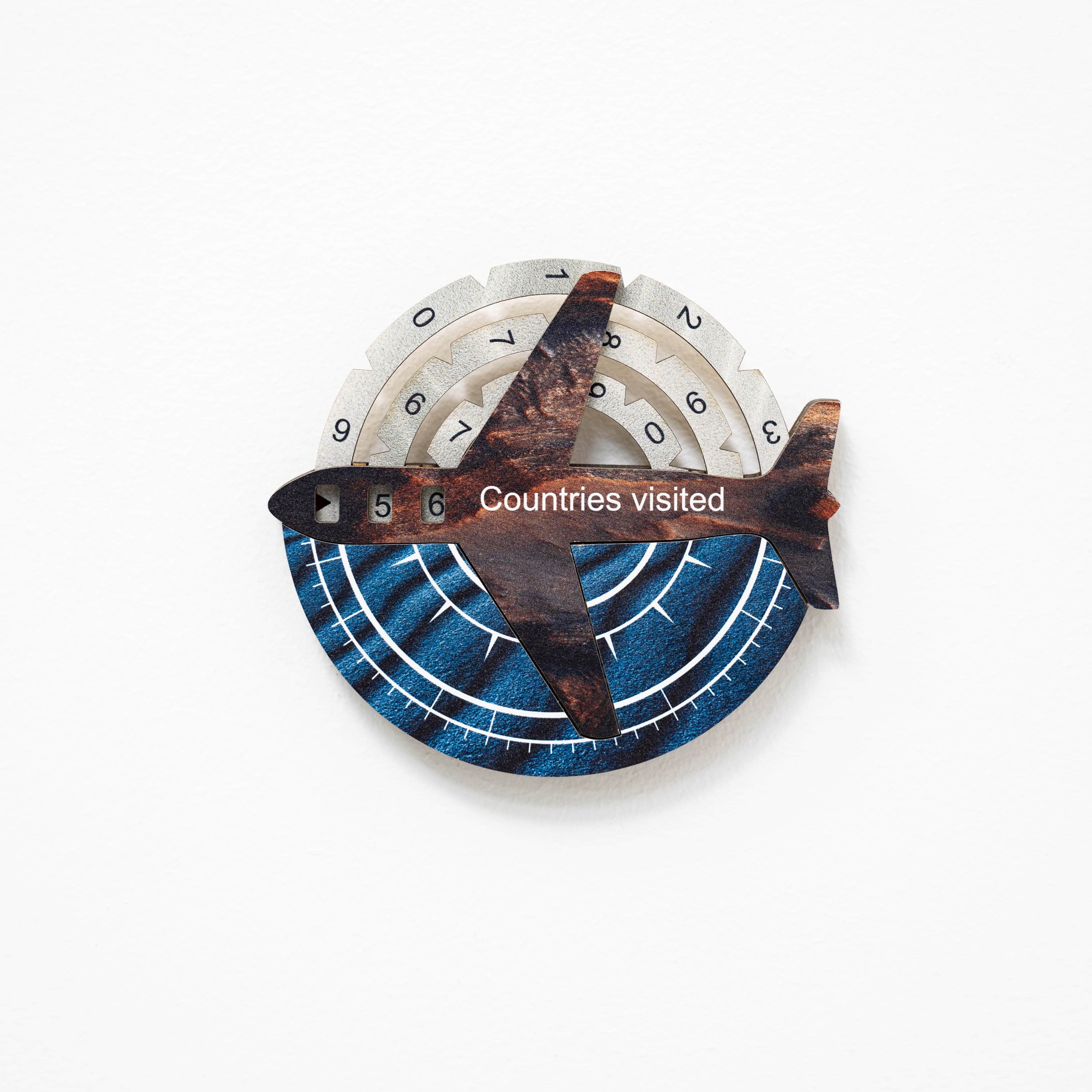 Decorative item with airplane design and numbered circle on a white background