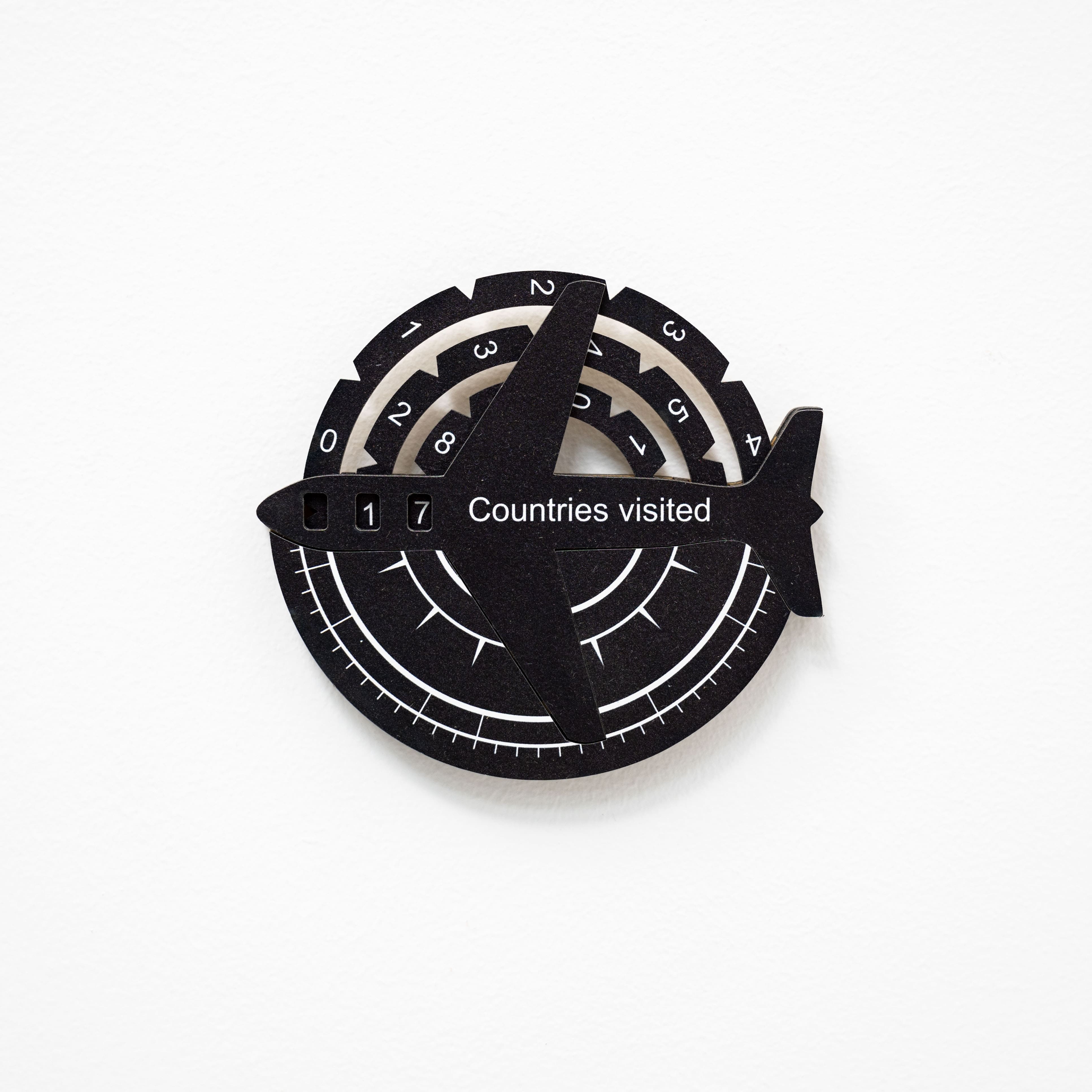 Black and white travel tracker with numbered circles on a white background