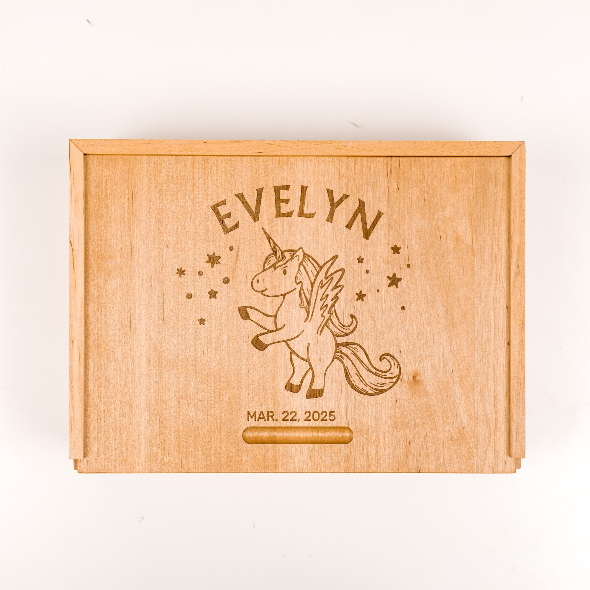 Wooden plaque with engraved unicorn and personalized text on a white background