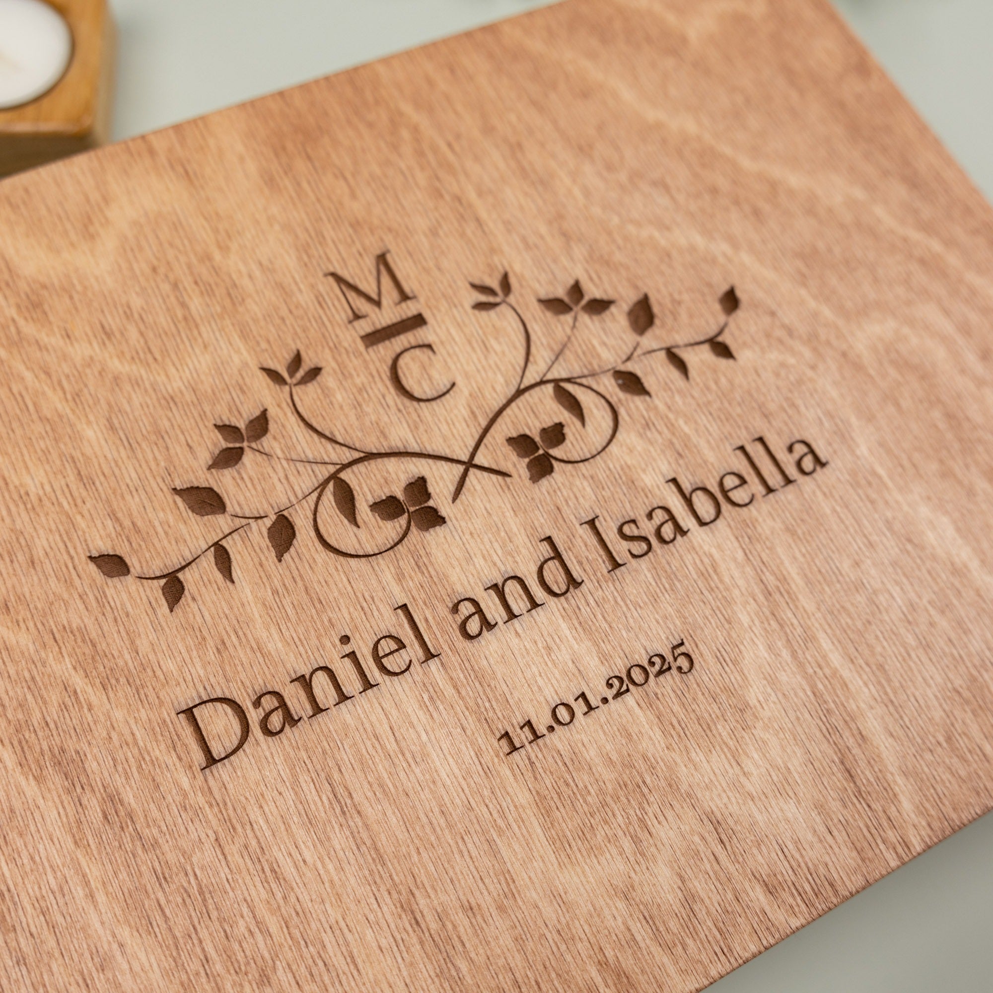 Wooden cutting board with engraved initials and names